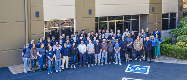 Photo of Puget Systems Employees in Front of Our Building in 2025